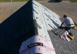 Professional roofing team repairing a residential roof in West Des Moines